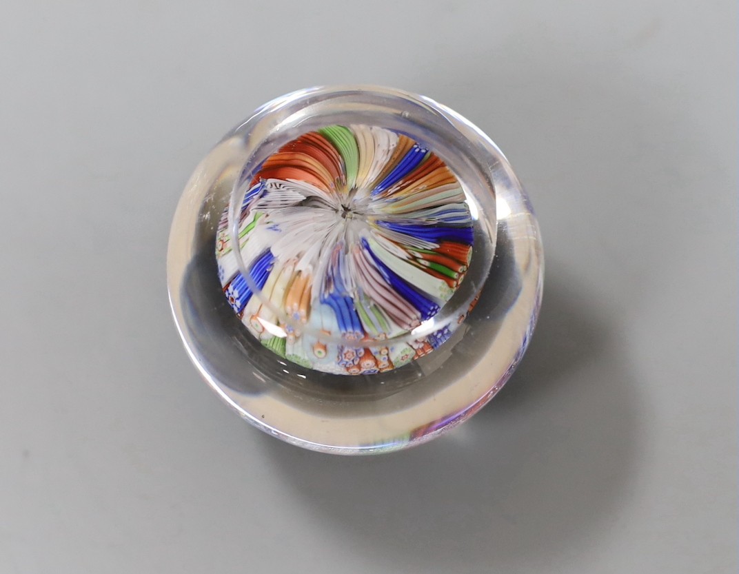 A Baccarat millefiori paperweight, with dog, huntsman and cockerel silhouette canes, 4cms wide